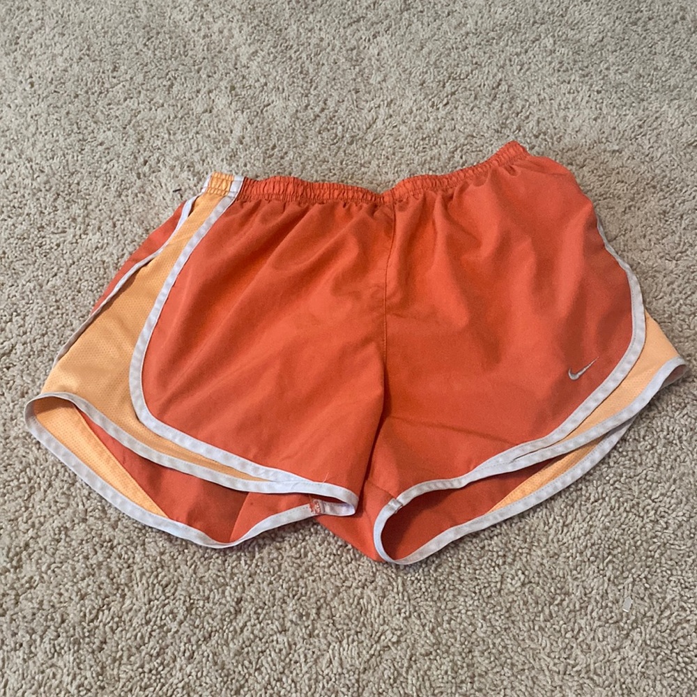 Orange Nike dri-fit shorts